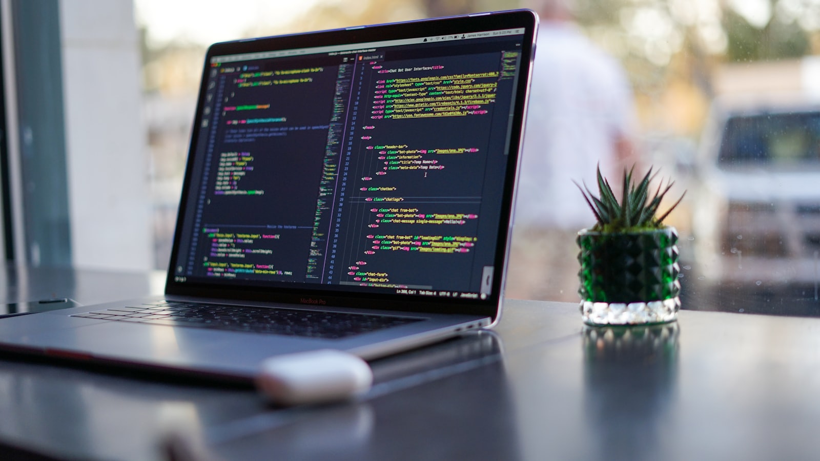 Software engineering workspace with multiple monitors